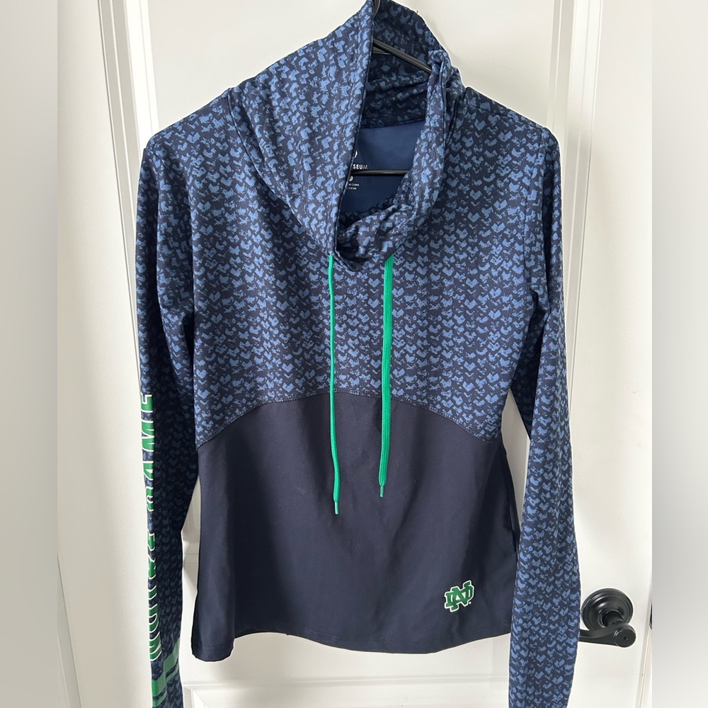 Slightly worn, cowl neck top support Notre Dame Fighting Irish.